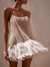 Robe courte dos nu en maille à pampilles Marie